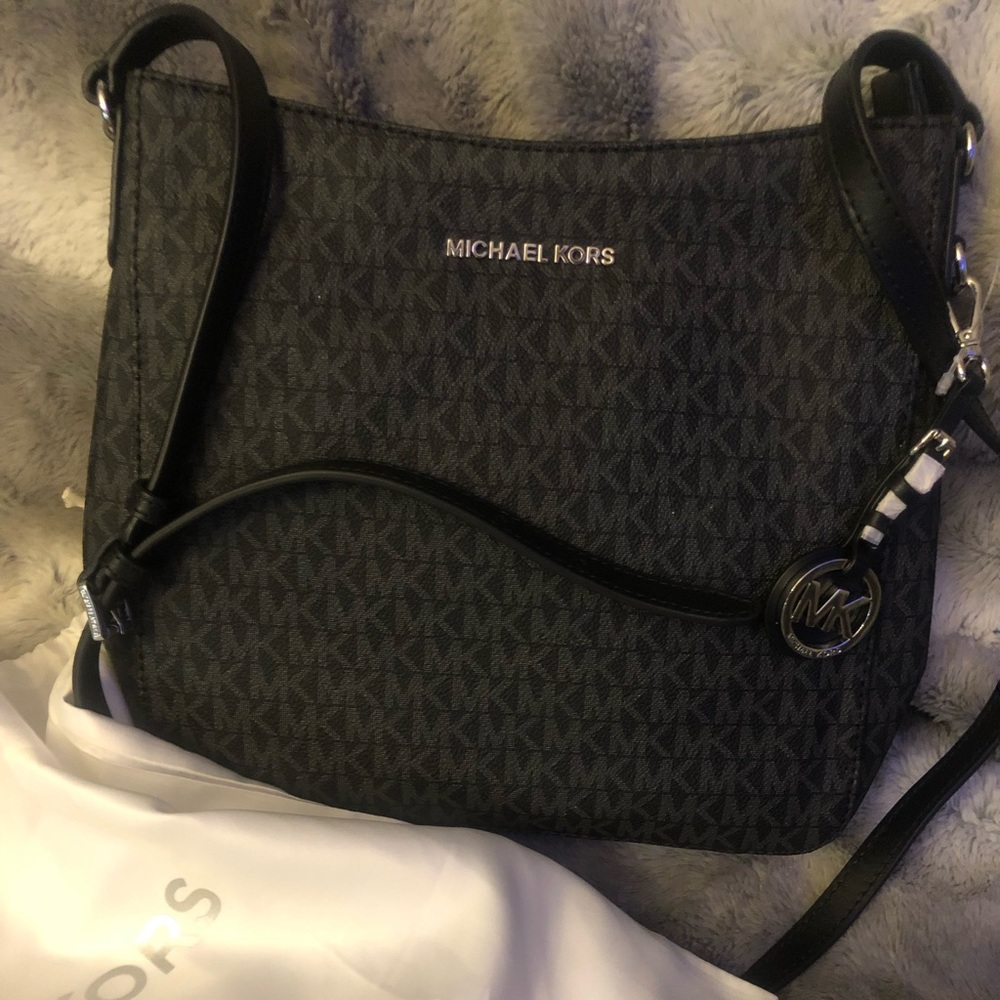 Michael Kors crossbody medium sized, new/never used includes duster